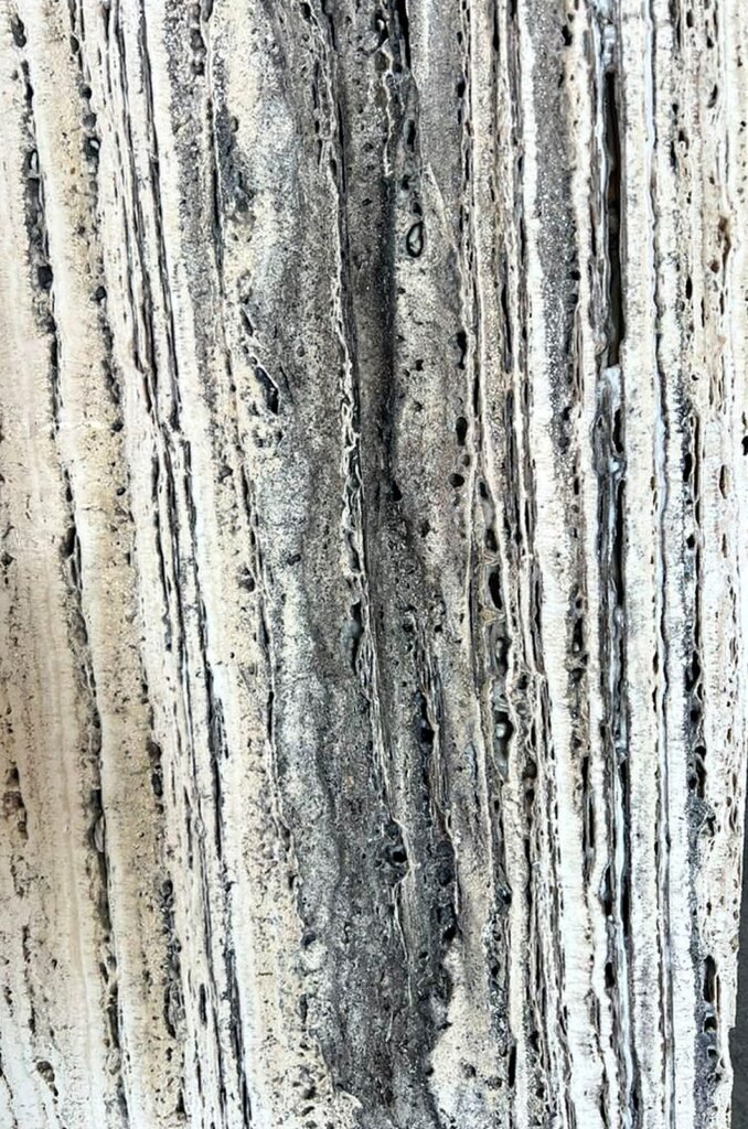 Close-up of unfilled vein-cut Persian Silver Travertine showing natural pores and voids