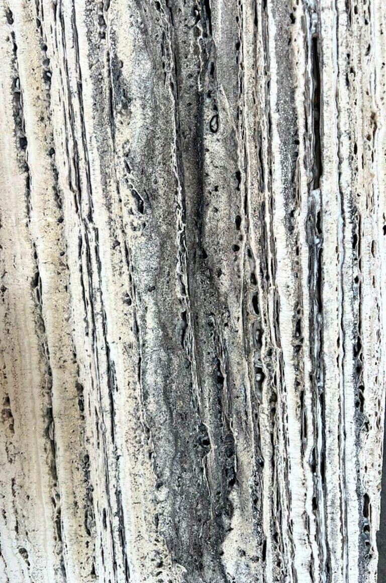 Close-up of unfilled vein-cut Persian Silver Travertine showing natural pores and voids