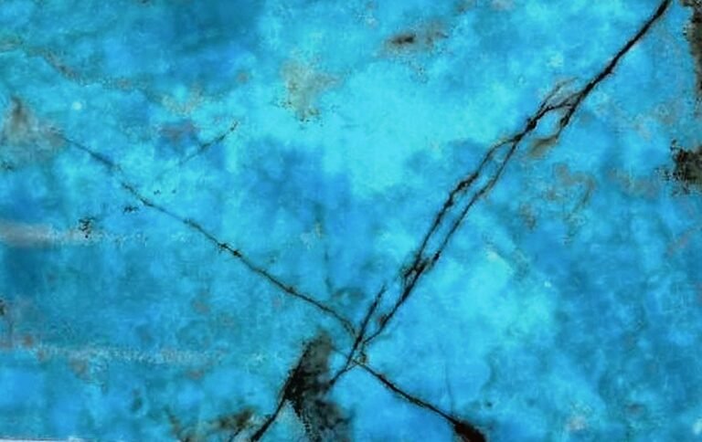 Turquoise Blue Onyx slab with vivid cyan crystal and sharp rust veins